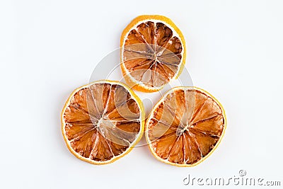 Dried orange slices on white background. Stock Photo