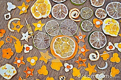 Dried oranges, tangerine, lemon, lime on wooden background. Stock Photo