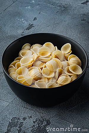 Dried pasta shells, on gray background Stock Photo