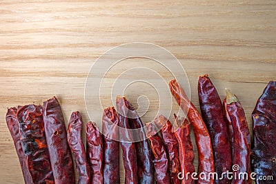 Dried red chili peppers on slate background. Ingredient for thai food on wood table background Stock Photo