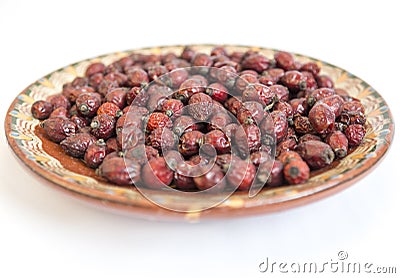 Dried rose hips plate Stock Photo