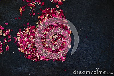 Dried rose petals in heart shape Stock Photo