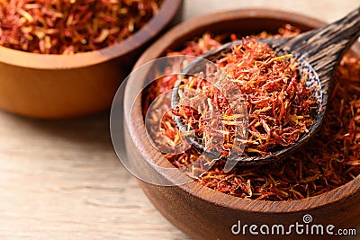 Dried safflower in spoon and bowl Stock Photo