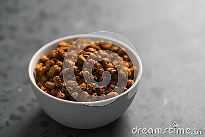 Dried seaberry buckthorn in white bowl on terrazzo countertop with copy space Stock Photo