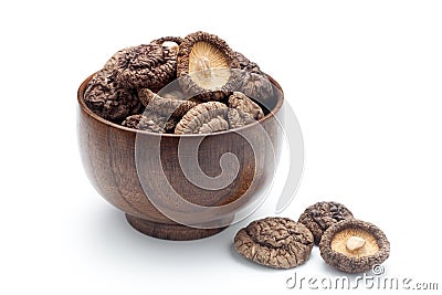 Dried shiitake mushrooms in a wooden bowl Stock Photo