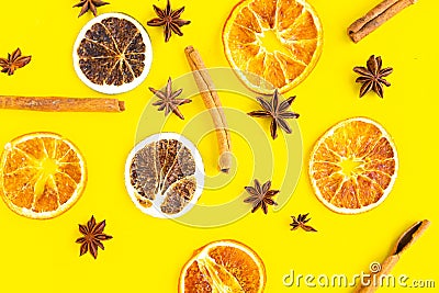 slices citrus and star anise pattern on bright yellow background Stock Photo