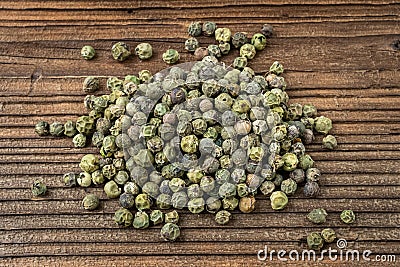 Dried spices green pepper on a wooden board Stock Photo