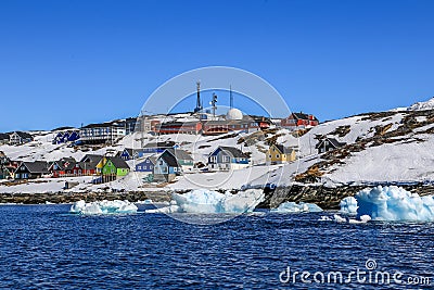 Drifting icebergs along Nuuk city shore Stock Photo