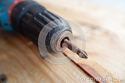 Drill and rusty screwdriver Stock Photo