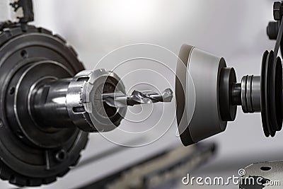 drill bit on tool grinding machine. The tool regrinding process. At machanical department in the factory Stock Photo