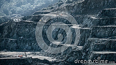 Drilling machines and loader working in diabase quarry Stock Photo