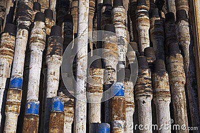 Drilling pipe. Rusty drill pipes were drilled in the well section. Downhole drilling rig. View of the shell of drill pipes and Stock Photo