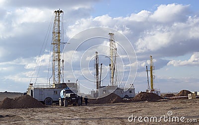 Drilling rigs working in the steppe Stock Photo