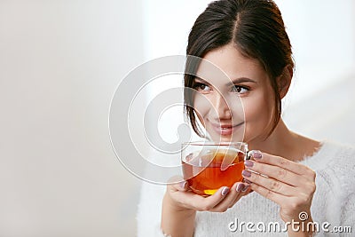 Drink. Beautiful Woman Drinking Tea From Cup Stock Photo