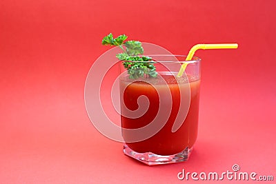 Is a glass of freshly squeezed tomato juice with straws Stock Photo