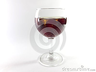 Drink with fruit in a transparent glass. Cherry for a snack. Liquid in a glass. Photo Stock Photo