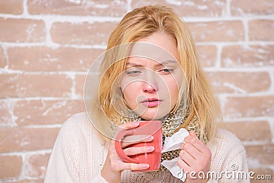 Drink more liquid get rid of cold. Drinking plenty fluid important for ensuring speedy recovery from cold. Girl hold tea Stock Photo