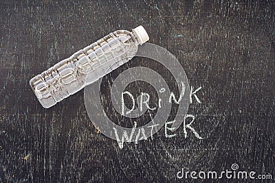 Drink more water - hydration reminder - handwriting on On a chalk board Stock Photo