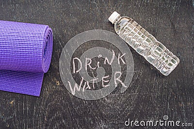 Drink more water - hydration reminder - handwriting on On a chalk board Stock Photo