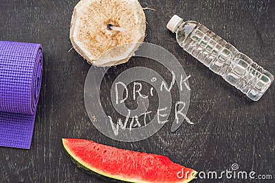 Drink more water - hydration reminder - handwriting on On a chalk board Stock Photo