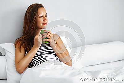 Drink Morning Tea. Woman Drinking Beverage In Bed. Healthy Lifesyle Stock Photo