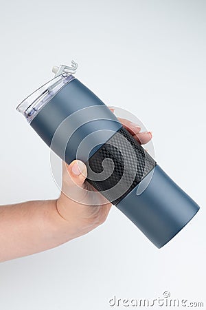 Drink from reusable blue flask Stock Photo
