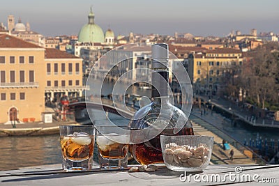 Drink for two in Venice - two glasses of lying liqueur and a bottle Stock Photo