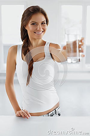 Drink Water. Happy Smiling Woman Drinking Water. Healthy Lifestyle. Health, Diet Concept. Stock Photo