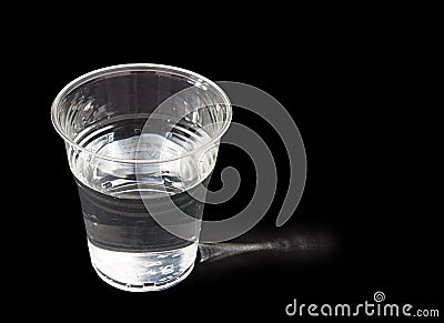 Drink of water, sidelit, over black background Stock Photo