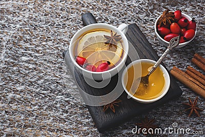 Drink from wild rose berries with lemon and honey cinnamon. Vitamin useful decoction of rose hips. cozy home concept of winter Stock Photo