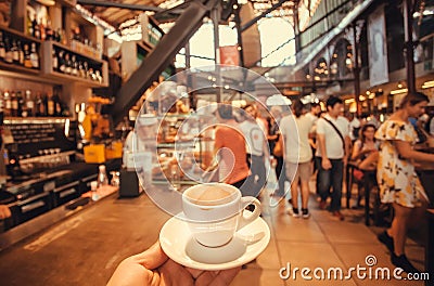 Drinking coffee inside huge space of modern market with bars, tables and fast food stores, Florence, Italy Editorial Stock Photo