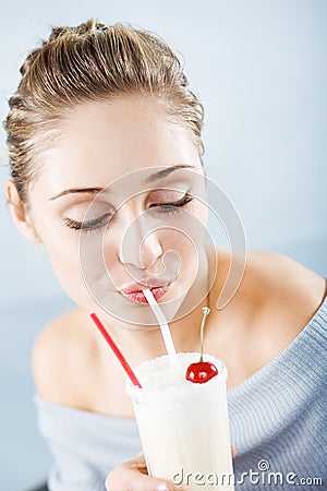 Drinking milk cocktail Stock Photo