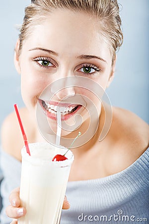 Drinking milk cocktail Stock Photo