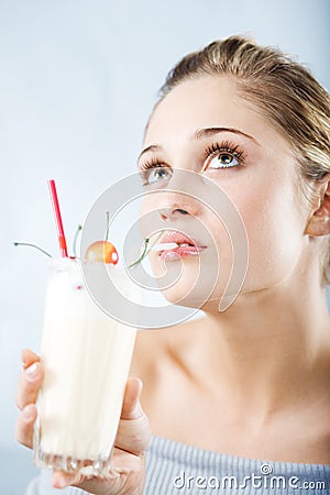 Drinking milk cocktail Stock Photo