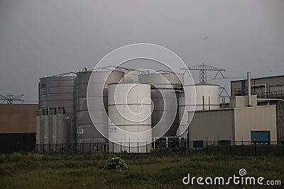 Drinking water and chemical tanks at Evides treatment plant in the Maasvlakte port of Rotterdam Editorial Stock Photo