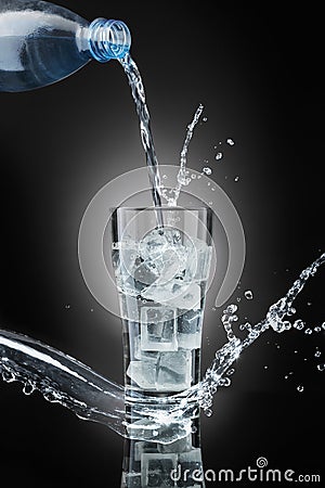 Drinking water,on dark background Stock Photo