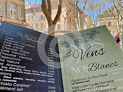 Drinks menu, old town of Aix en Provence in the background. Aix en Provence, France, 6.04.2023. Editorial Stock Photo