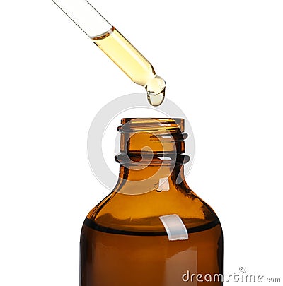 Dripping natural tea tree essential oil into bottle Stock Photo