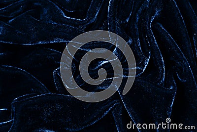 Drity blue fabric closeup. Velvet texture background. Classic blue color of year 2020. Stock Photo