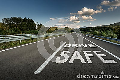 Drive safe message on Asphalt highway road through the countryside Stock Photo