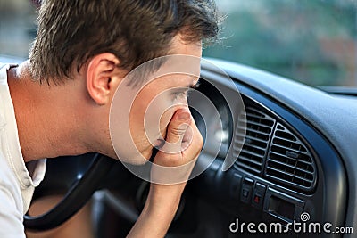 The driver held his nose from the bad smell , air conditioner heating, the concept of faulty air conditioners, bad smell and car, Stock Photo