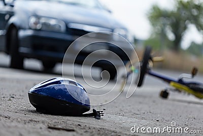 Driver hitting biker Stock Photo