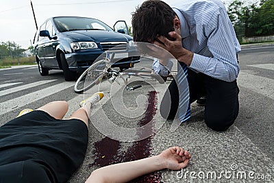 Driver and injured woman at road accident scene Stock Photo