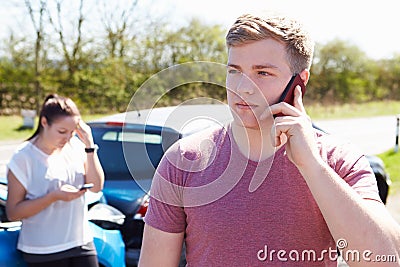 Driver Making Phone Call After Traffic Accident Stock Photo