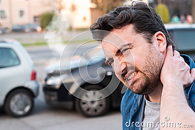 Driver portrait feeling pain after car accident Stock Photo