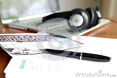 Driver`s log books with open laptop in the office Stock Photo