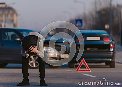 Driver is shocked after car wreck Stock Photo