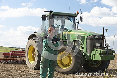 Driver Standing In Front Of Tractor Editorial Stock Photo