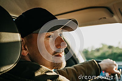 The driver or tourist inside the car is smiling Stock Photo