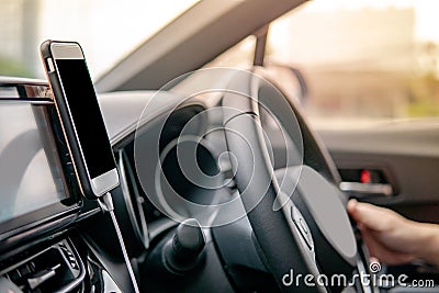 Driver using mobile app for GPS navigation Stock Photo